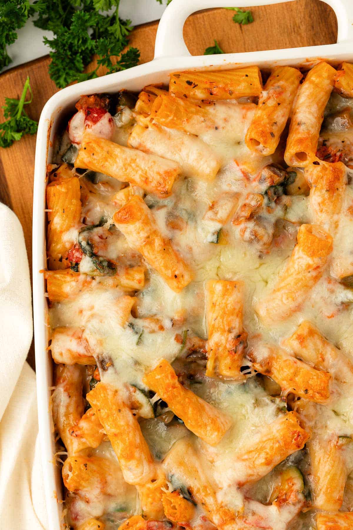 rigatoni noodles with sauce, vegetables, and cheese