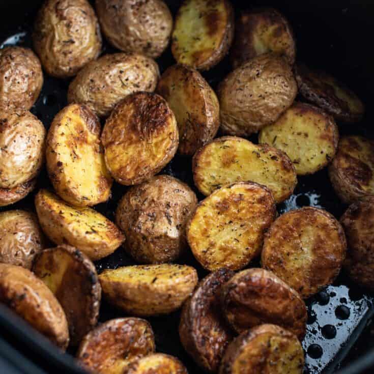 baby potatoes in an air fryer basket