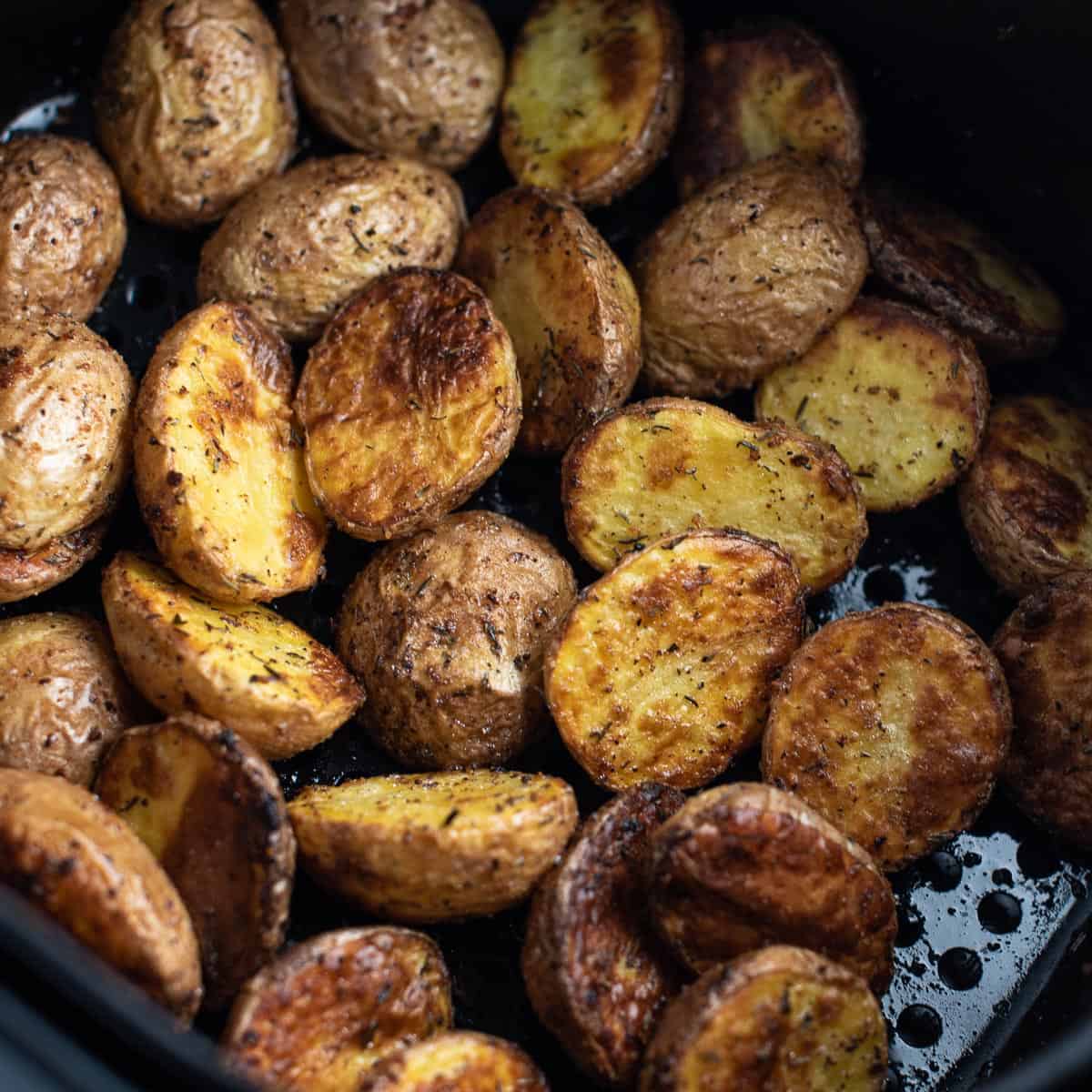 baby potatoes in an air fryer basket