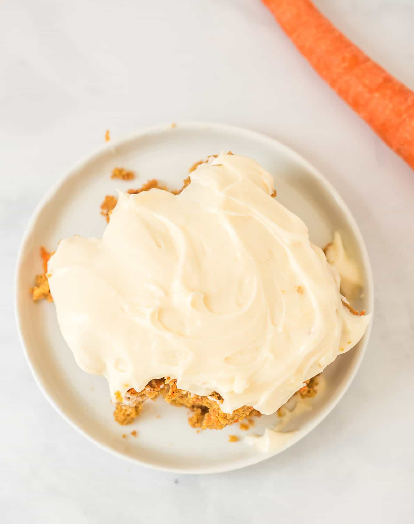 gluten free carrot cake slice on a white plate