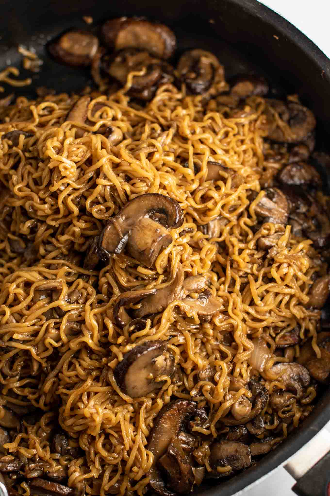 easy ramen stir fry with mushrooms from an overhead view in the pan