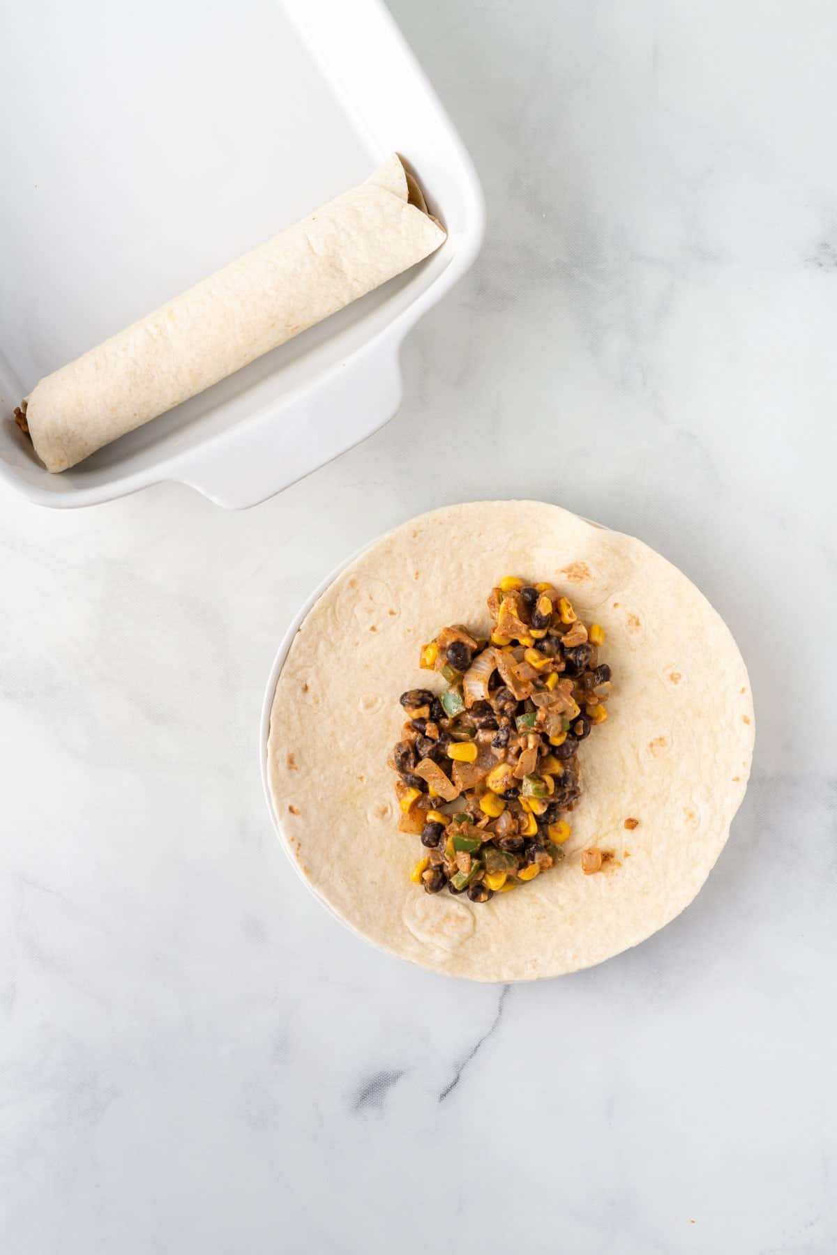 adding filling to a flour tortilla