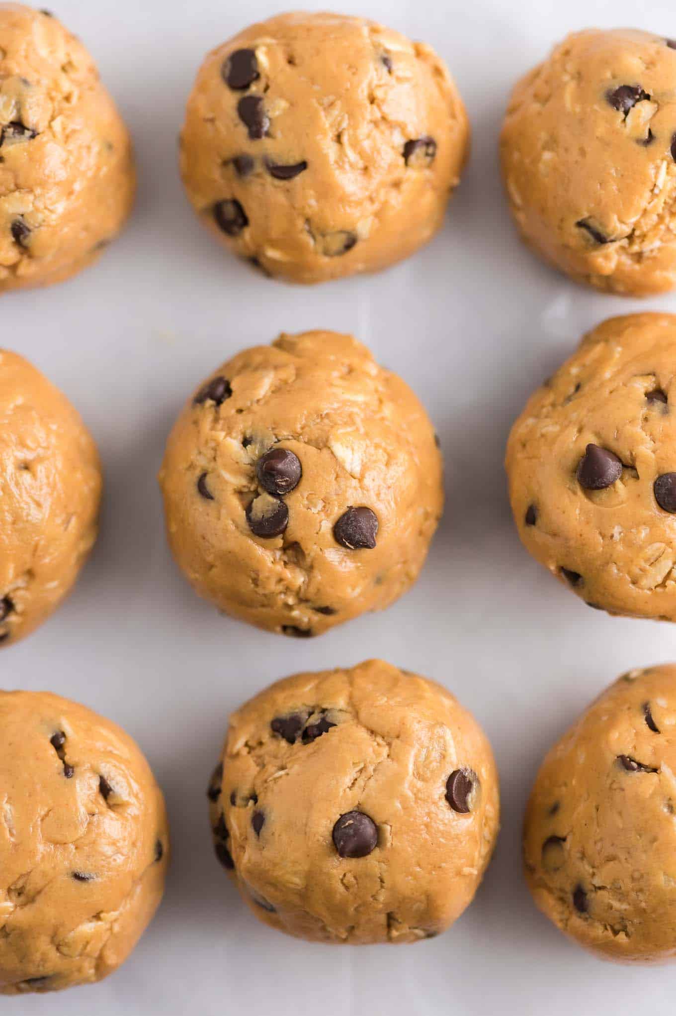 energy balls lined up on a baking sheet