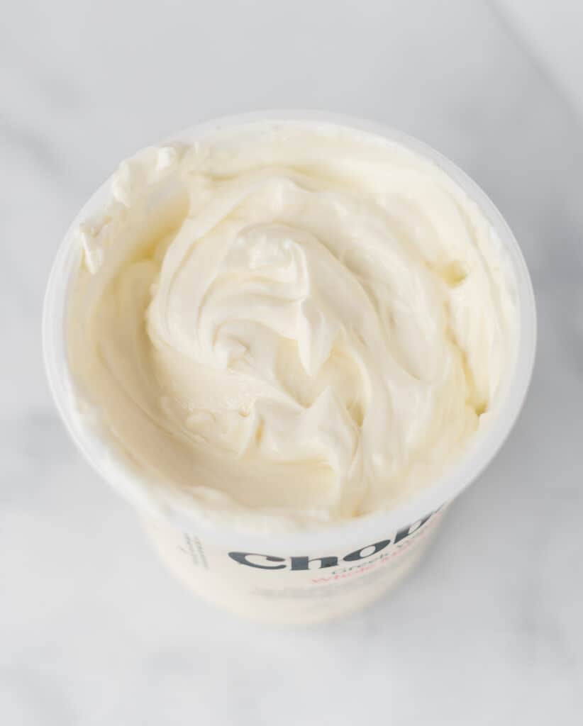a container full of greek yogurt
