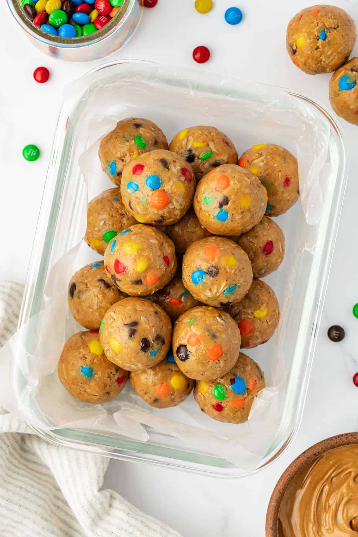 monster cookie protein balls in a storage container