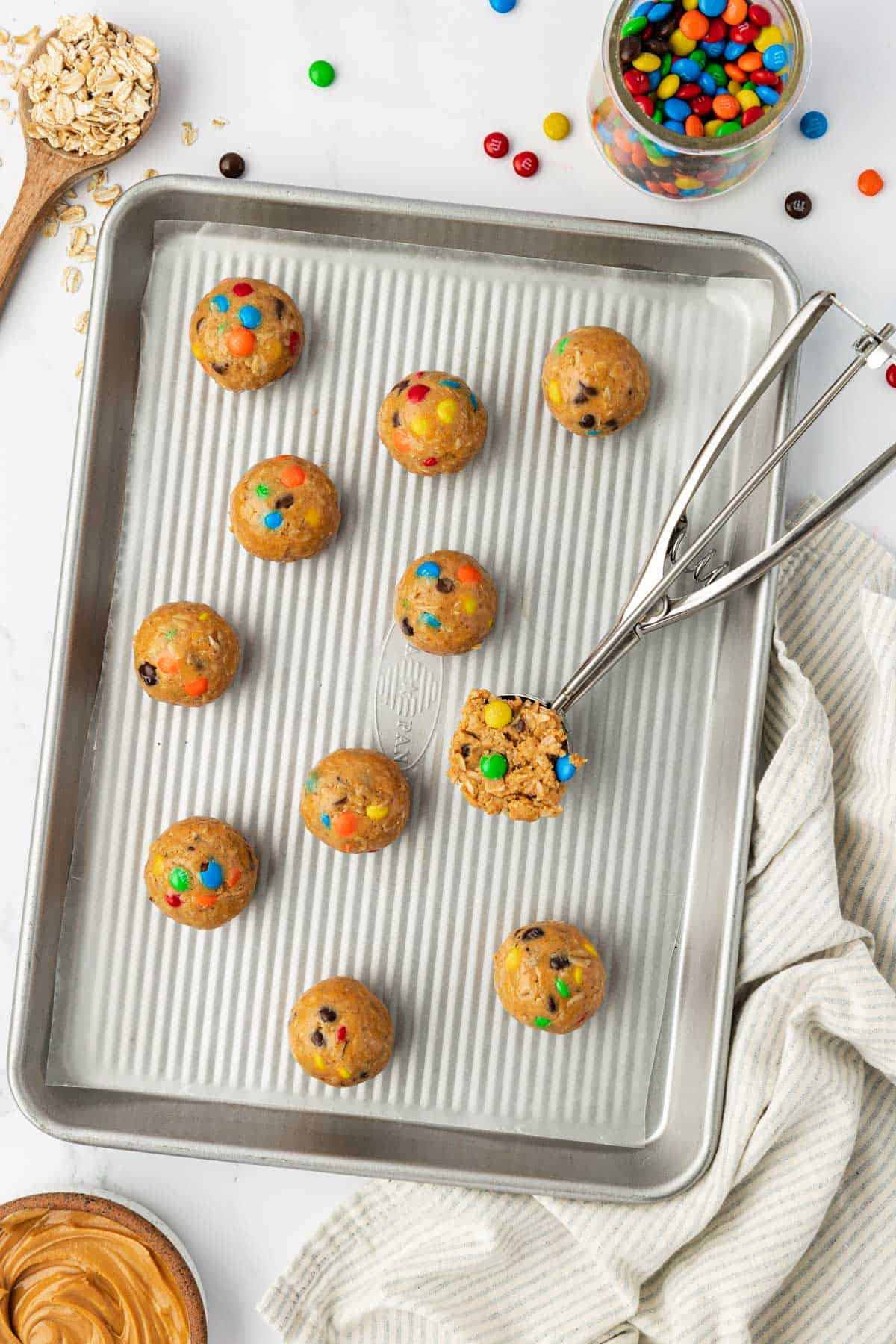 monster cookie bites on a baking sheet