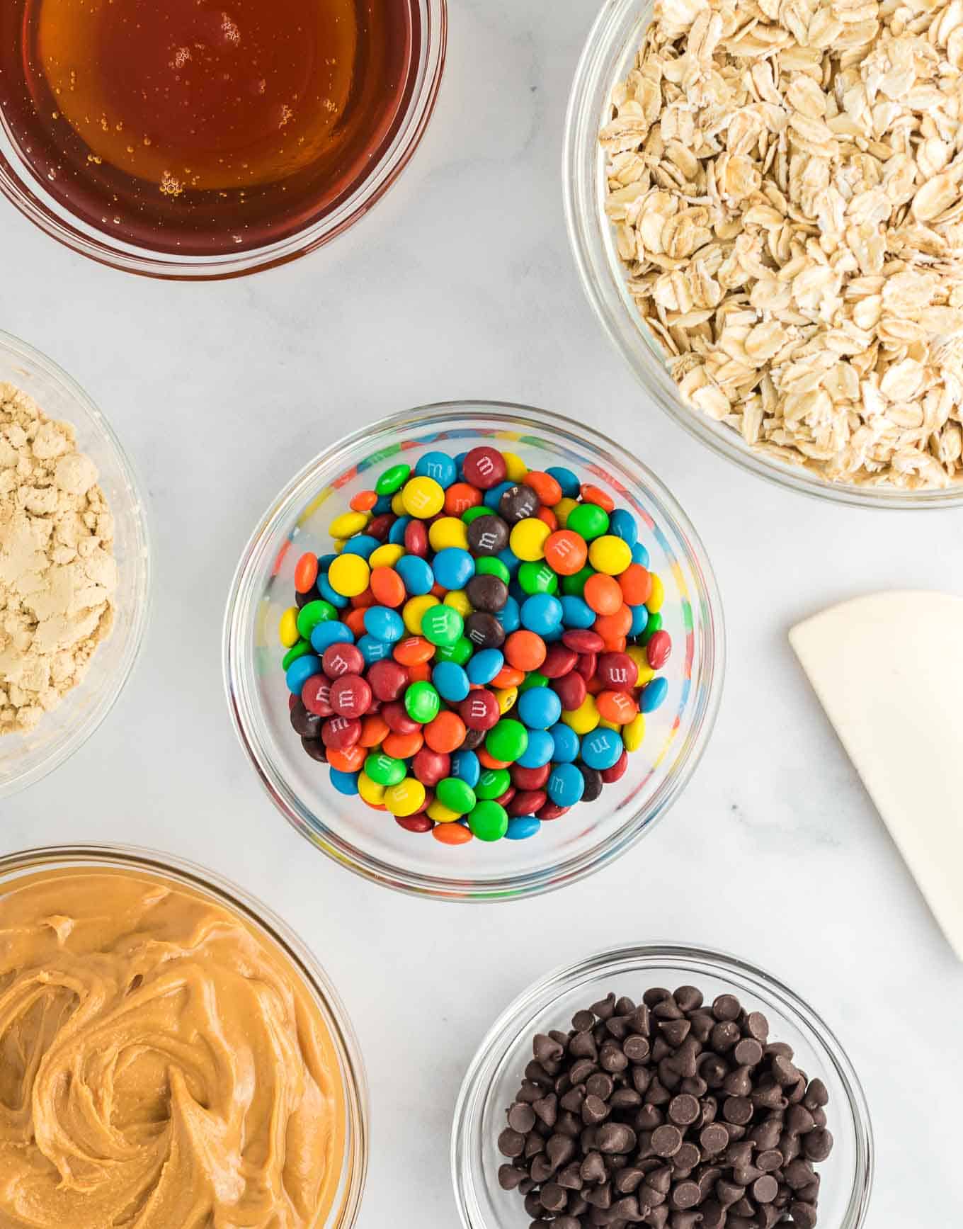 mini m&m's in a clear bowl surrounded by the other ingredients