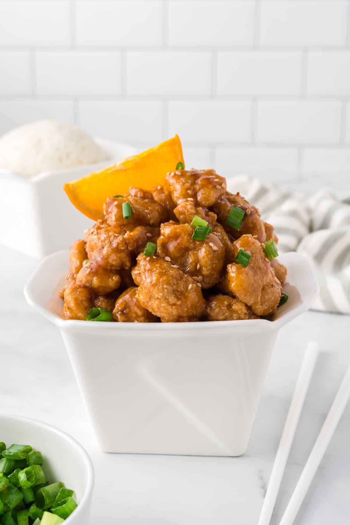 orange cauliflower in a takeout container