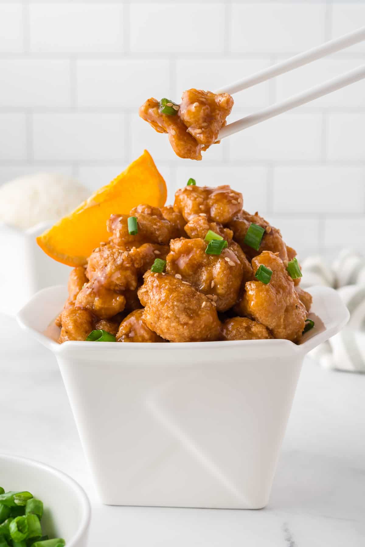 orange cauliflower in a takeout container