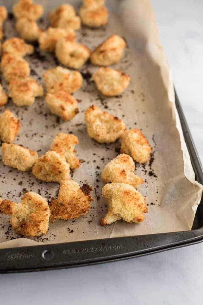the cooked crispy cauliflower bites on the baking sheet