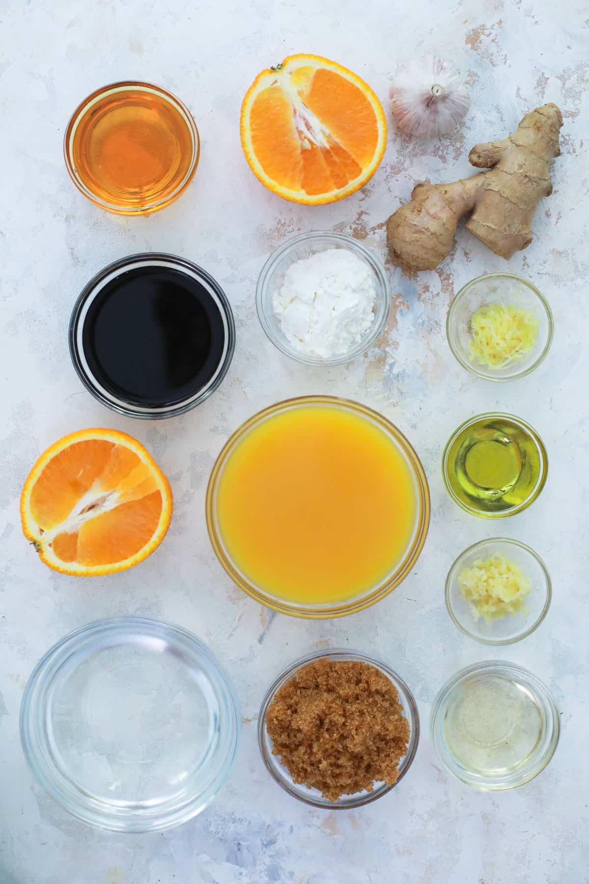 ingredients for orange sauce in glass bowls