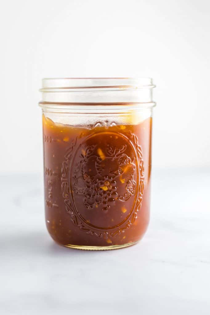 orange sauce in a mason jar