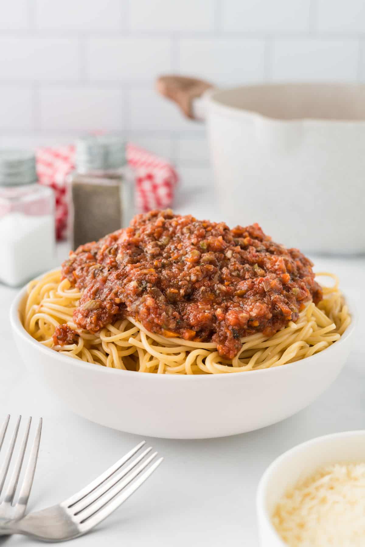 bowl of spaghetti topped with vegetarian bolognese sauce