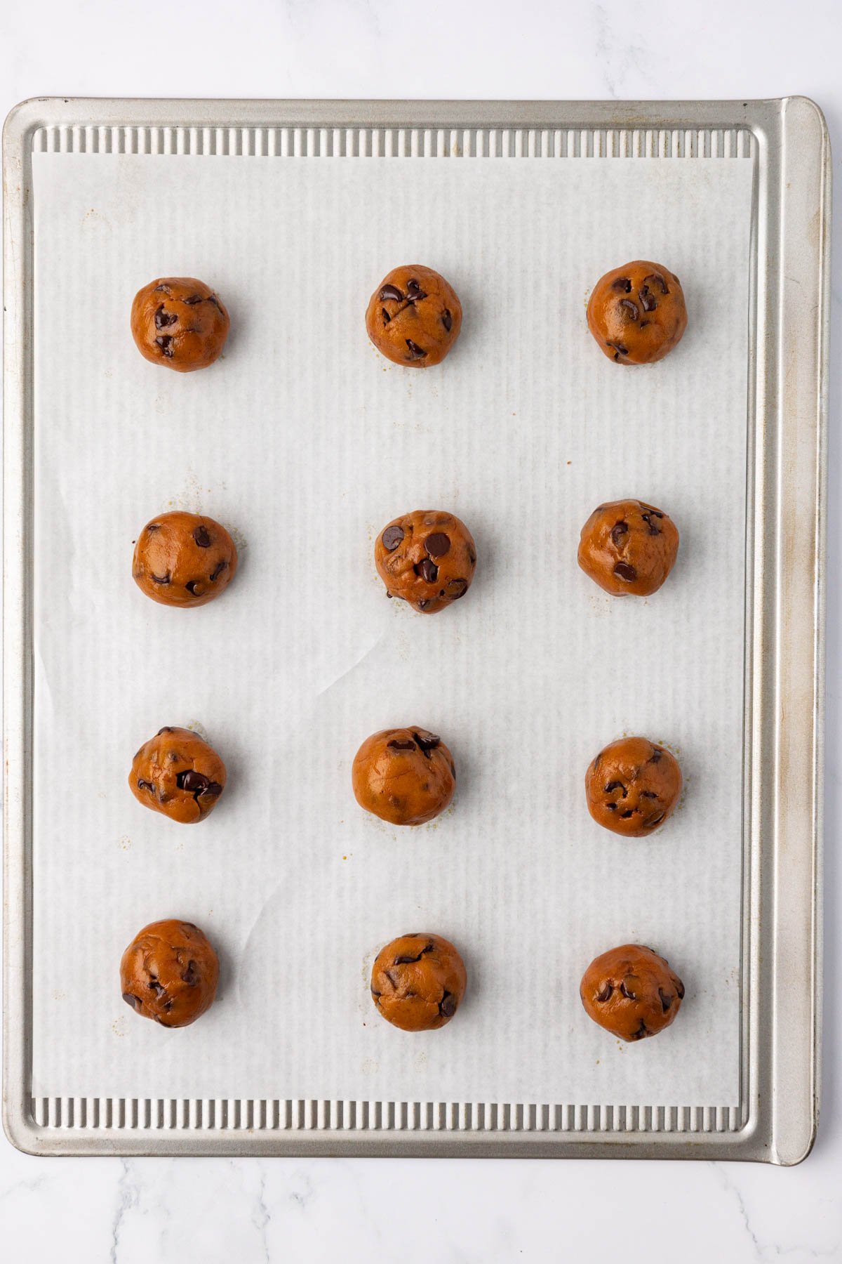 vegan pumpkin chocolate chip cookie dough on a baking sheet