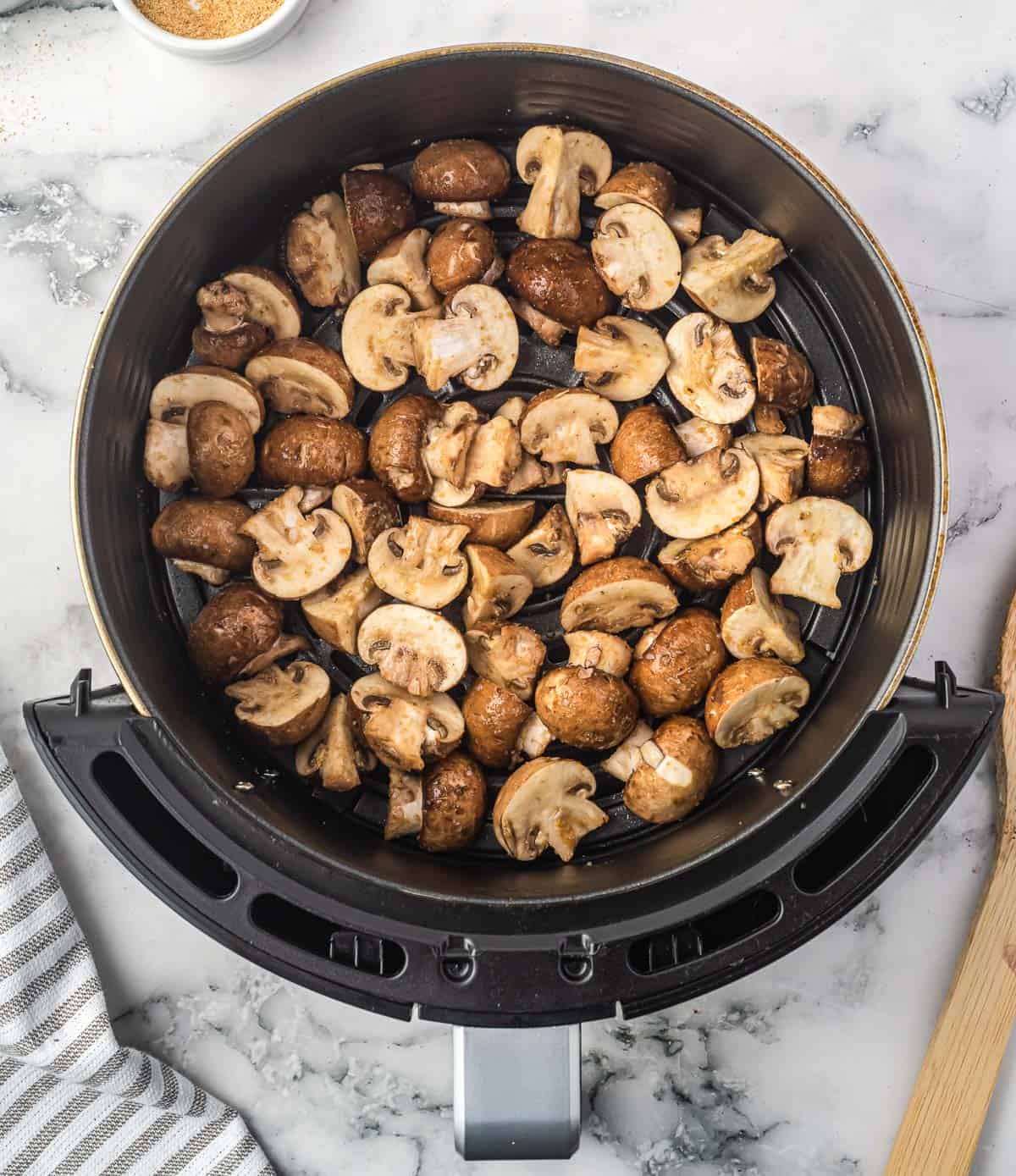 mushrooms placed in the air fryer basket