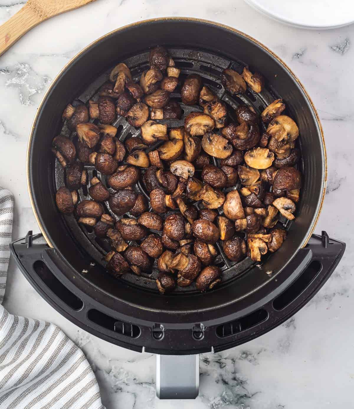 air fried mushrooms in the air fryer basket