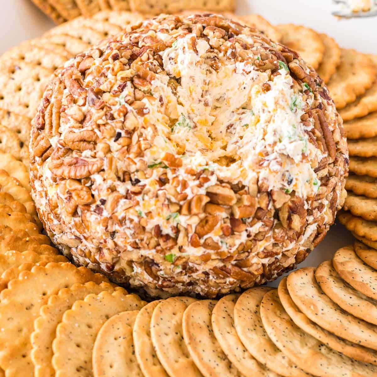 cheese ball with a chunk missing to show the inside