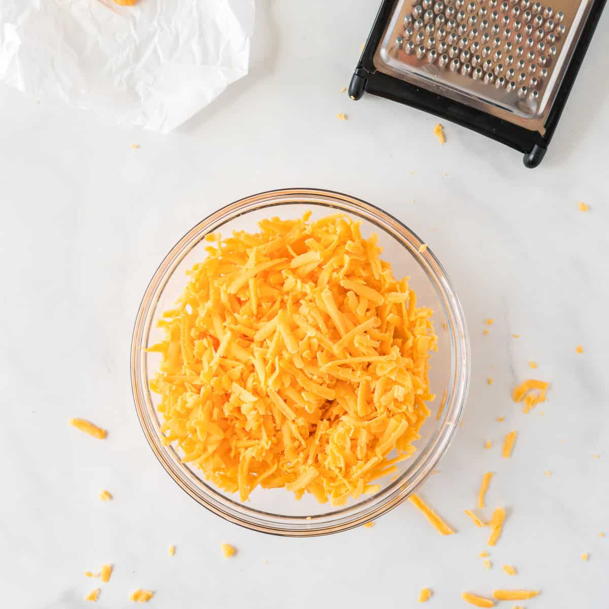 shredded cheddar cheese in a bowl