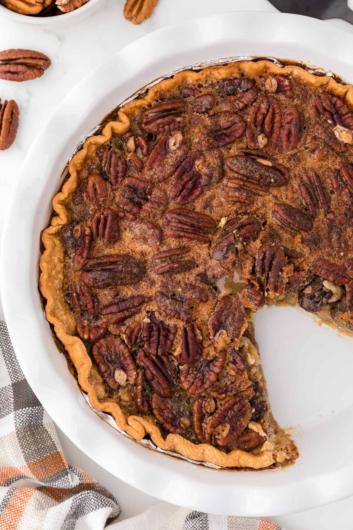 pecan pie with a slice taken out