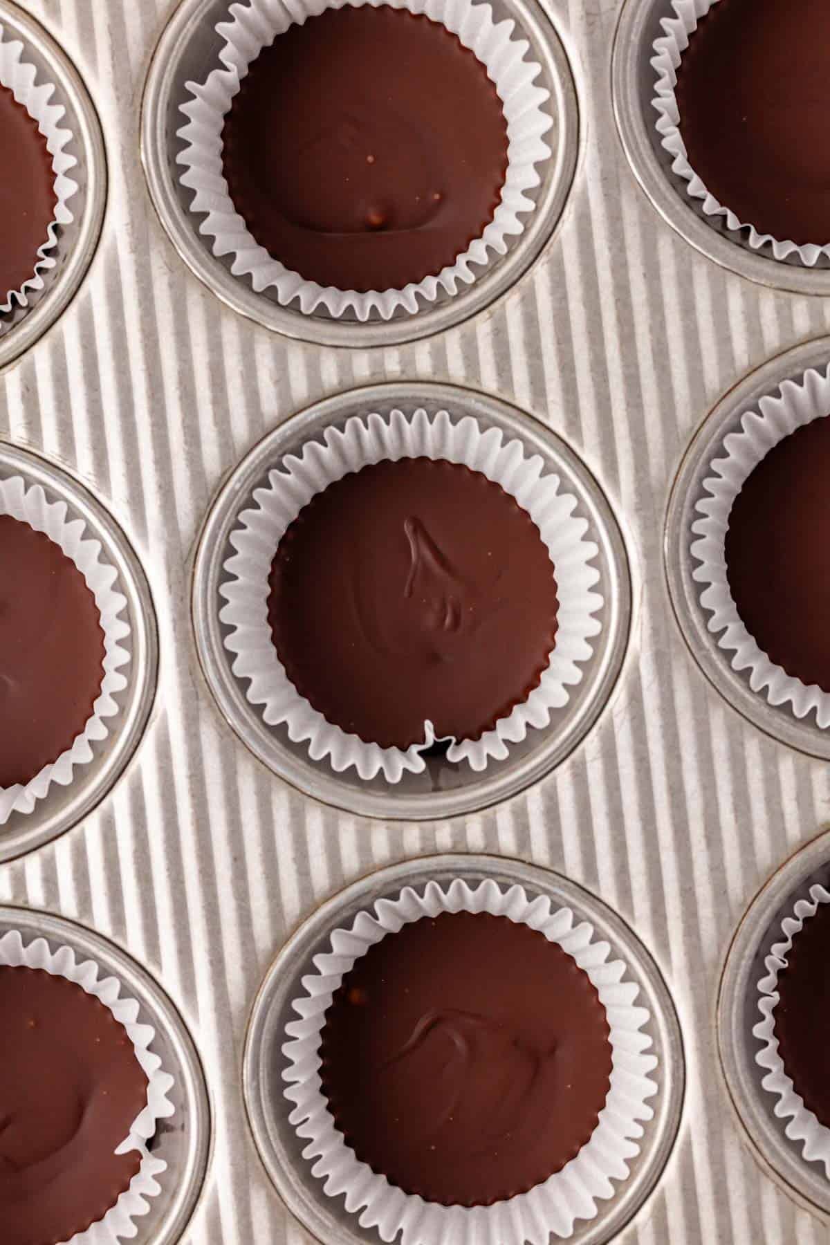 melted chocolate in the muffin tin