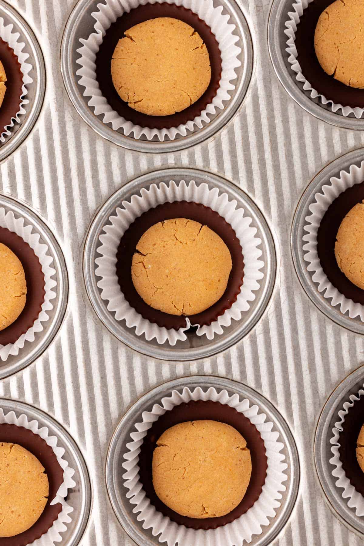adding the peanut butter filling over the melted chocolate