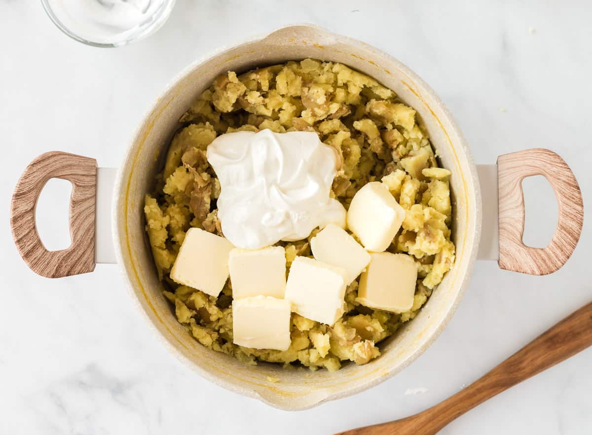 butter and sour cream added to the potatoes