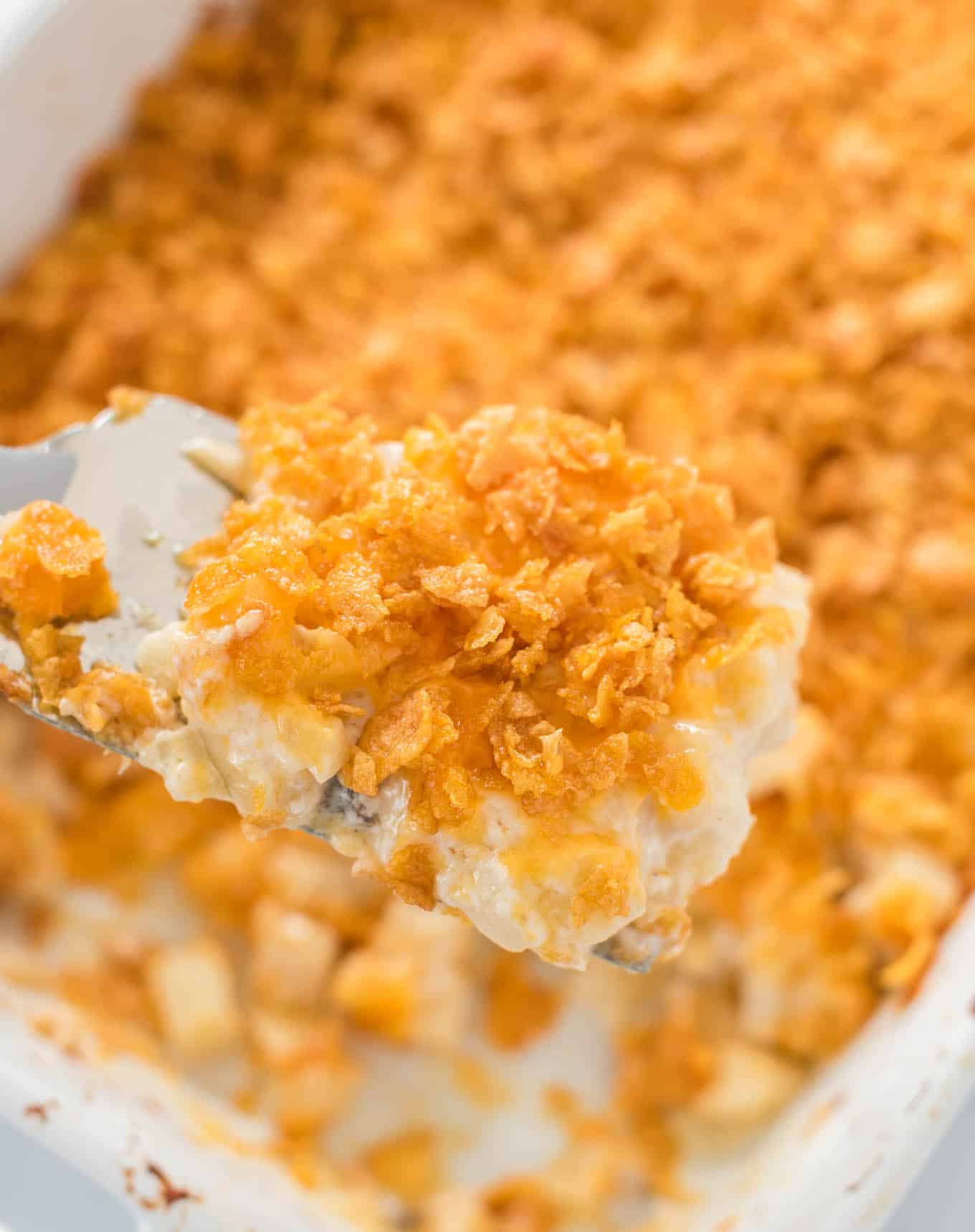 a scoop of funeral potatoes on a serving spatula