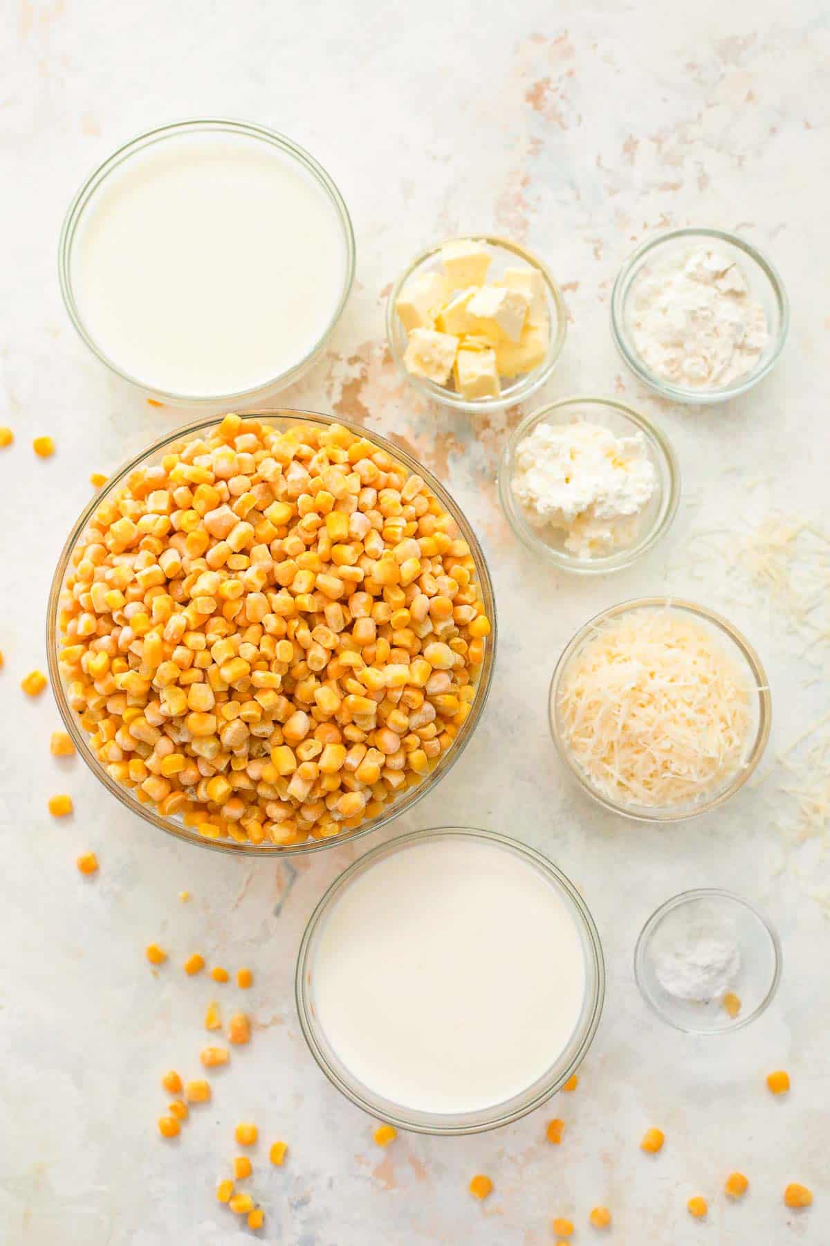 ingredients to make creamed corn in glass bowls