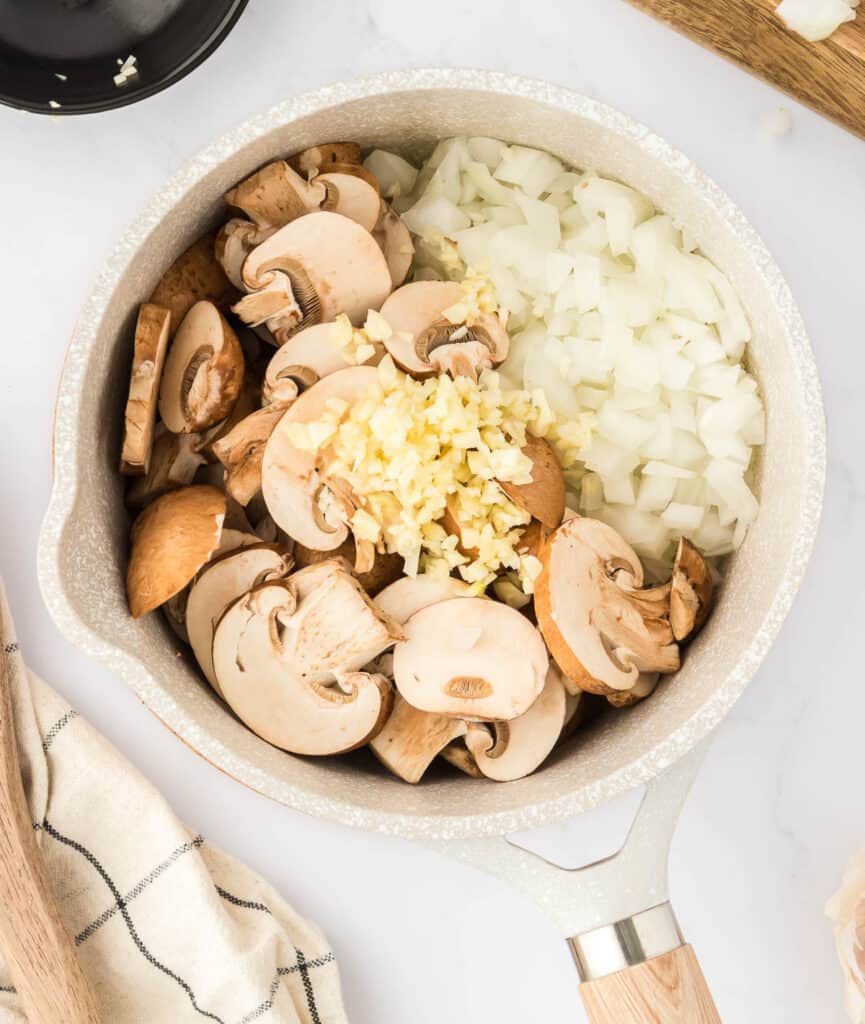 mushrooms, garlic, and onion in a sauce pan