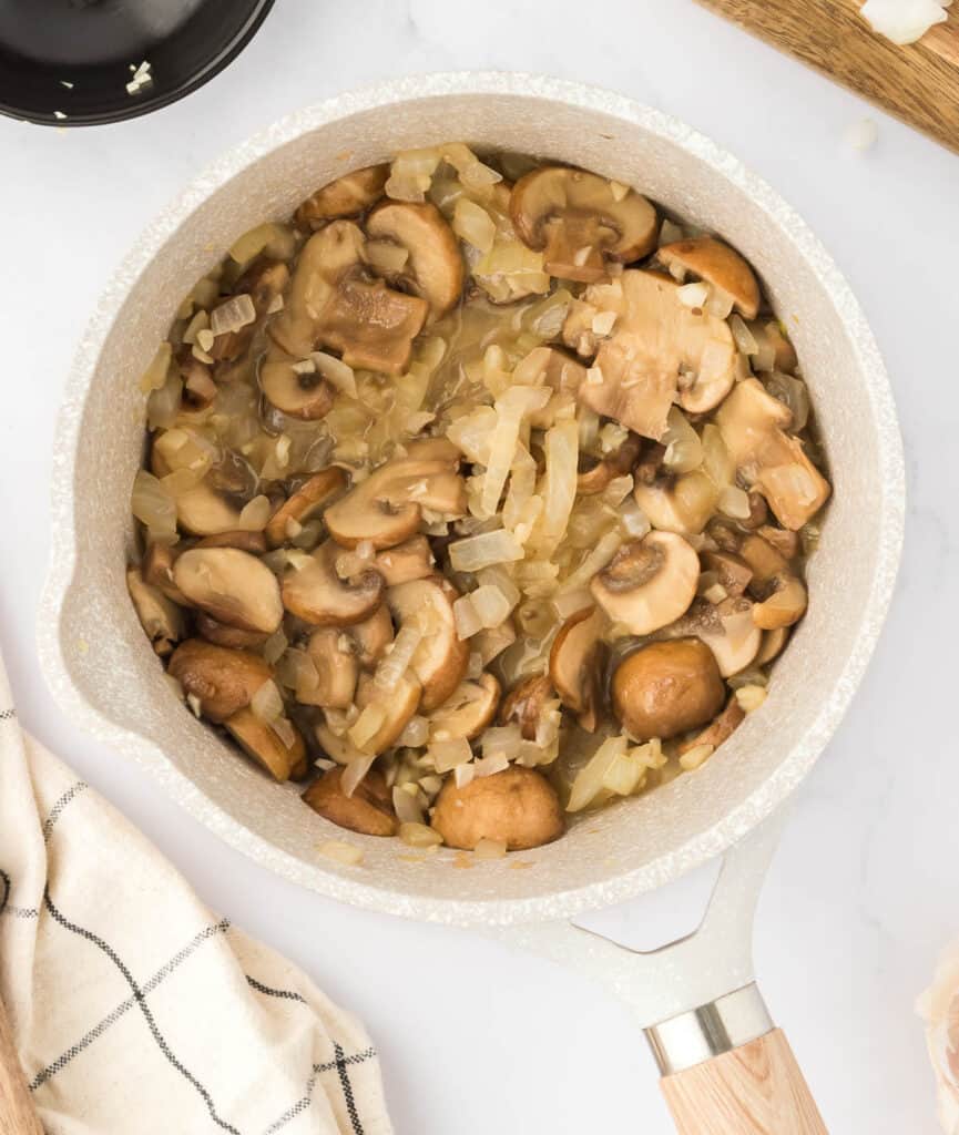 cooked mushrooms, garlic, and onion in a sauce pan