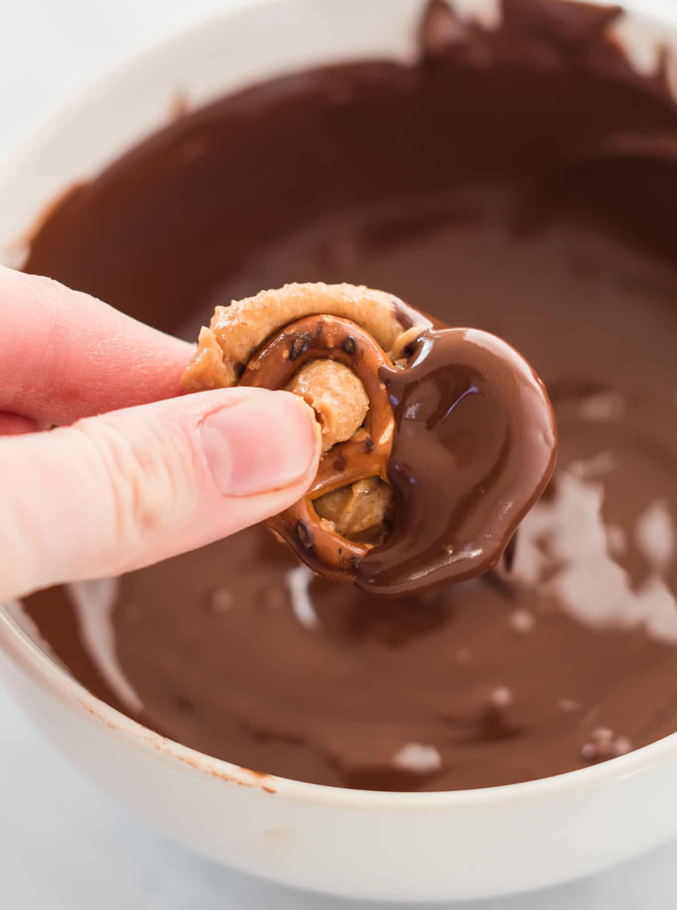 peanut butter stuffed pretzel dipped in melted chocolate