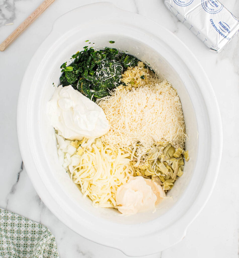 adding the ingredients to the crock pot