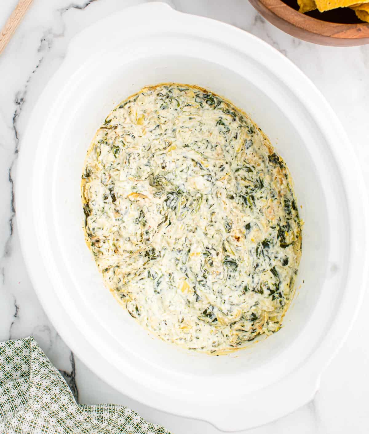 spinach artichoke dip in a slow cooker