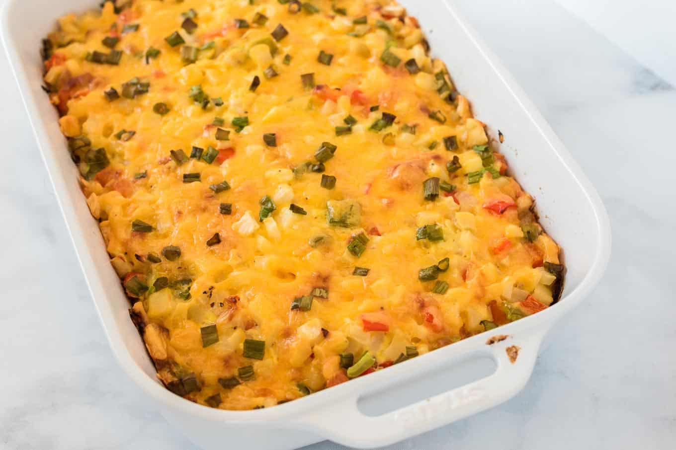 finished baked hash brown egg casserole in a white dish