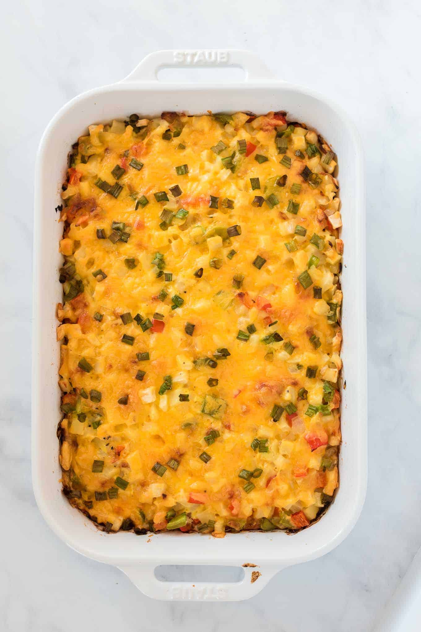 finished baked hash brown egg casserole in a white dish