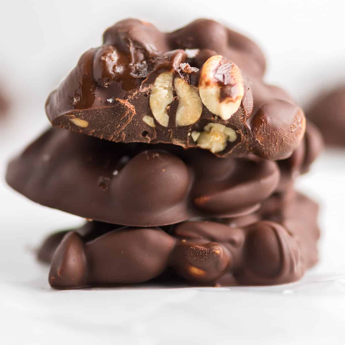 chocolate peanut cluster with a bite taken out