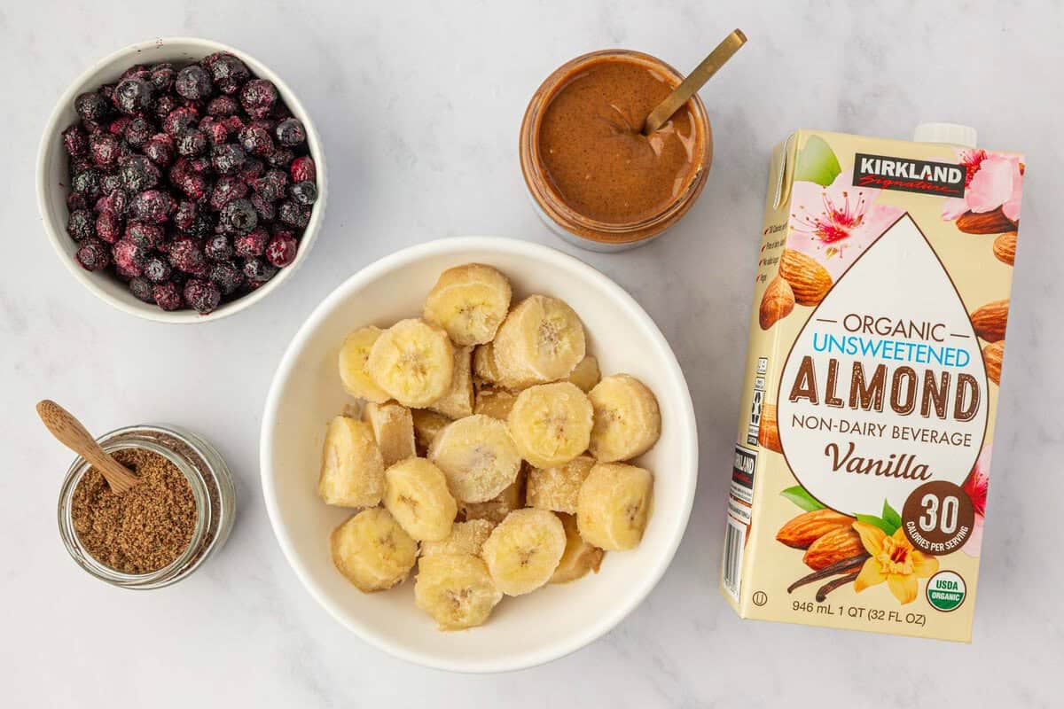 frozen bananas, frozen blueberries, almond butter, ground flax seed, and almond milk