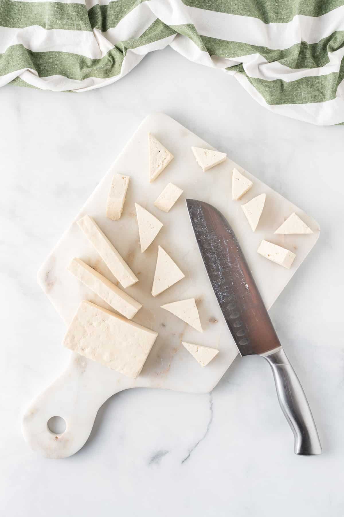 cutting the tofu into triangles