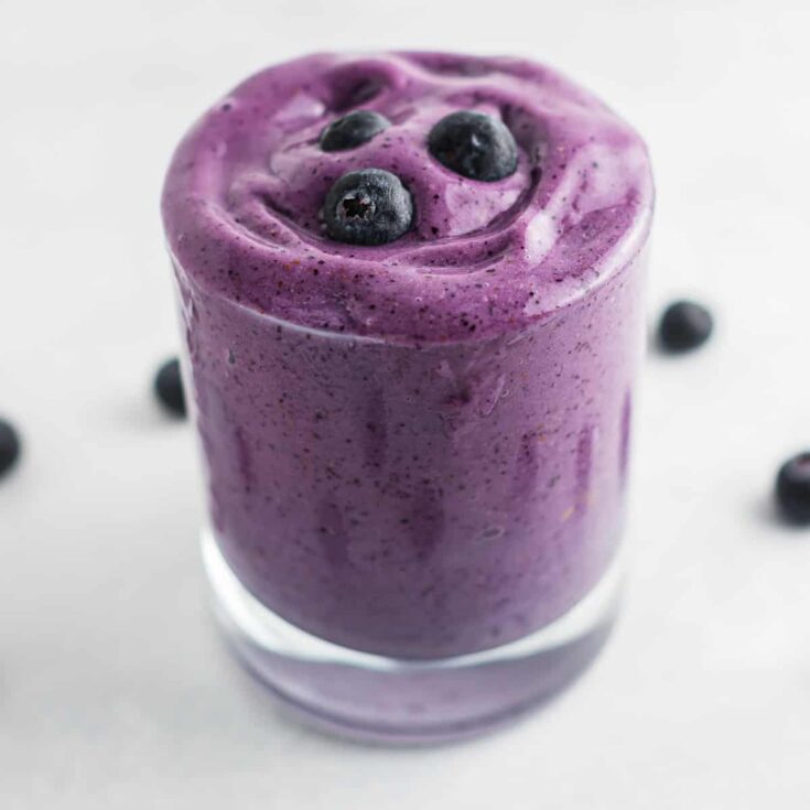 blueberry smoothie with blueberries on top