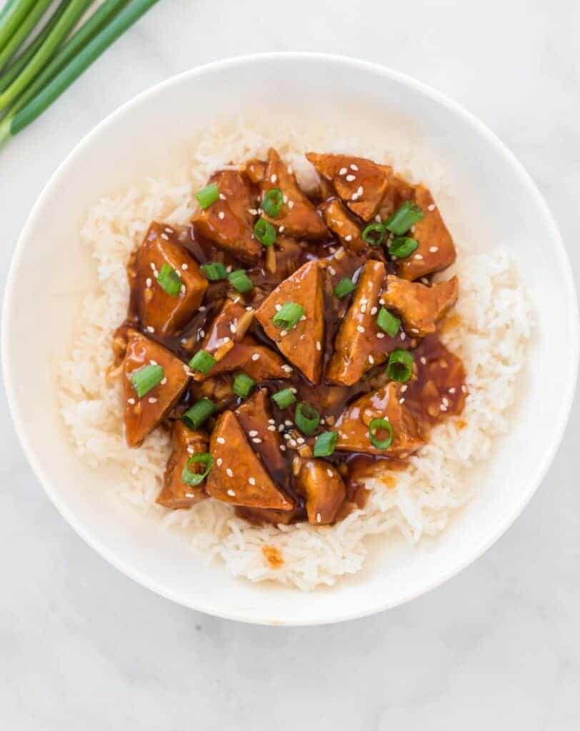 teriyaki tofu over white rice in a bowl