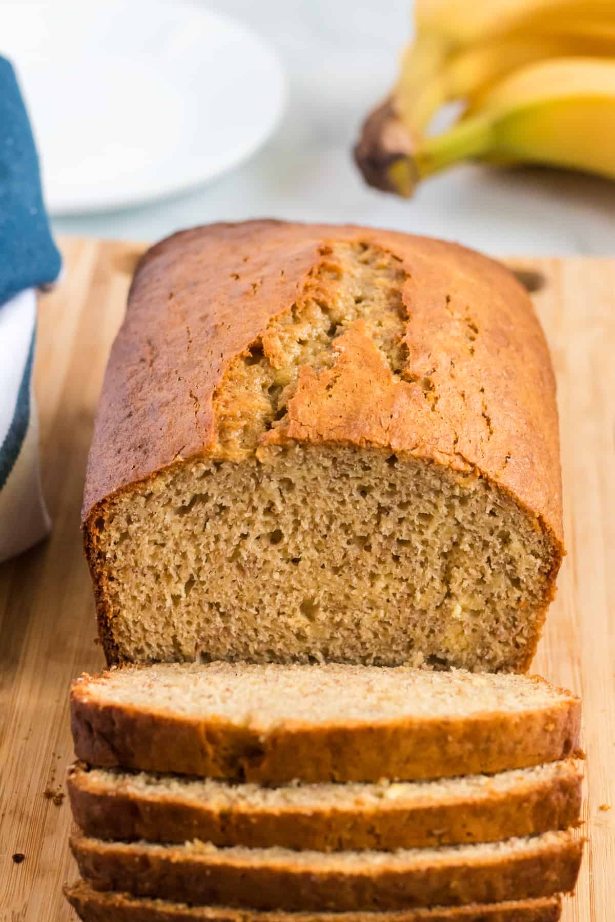 banana bread loaf being cut into slices