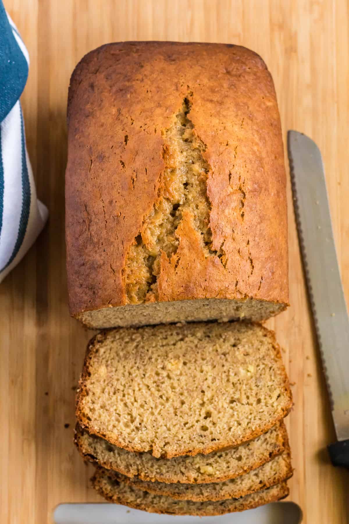 banana bread loaf being cut into slices