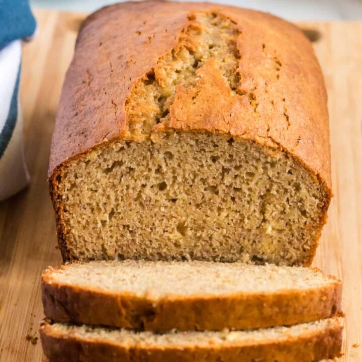 banana bread loaf being cut into slices