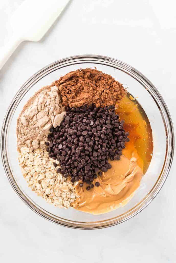 protein ball ingredients in a glass bowl