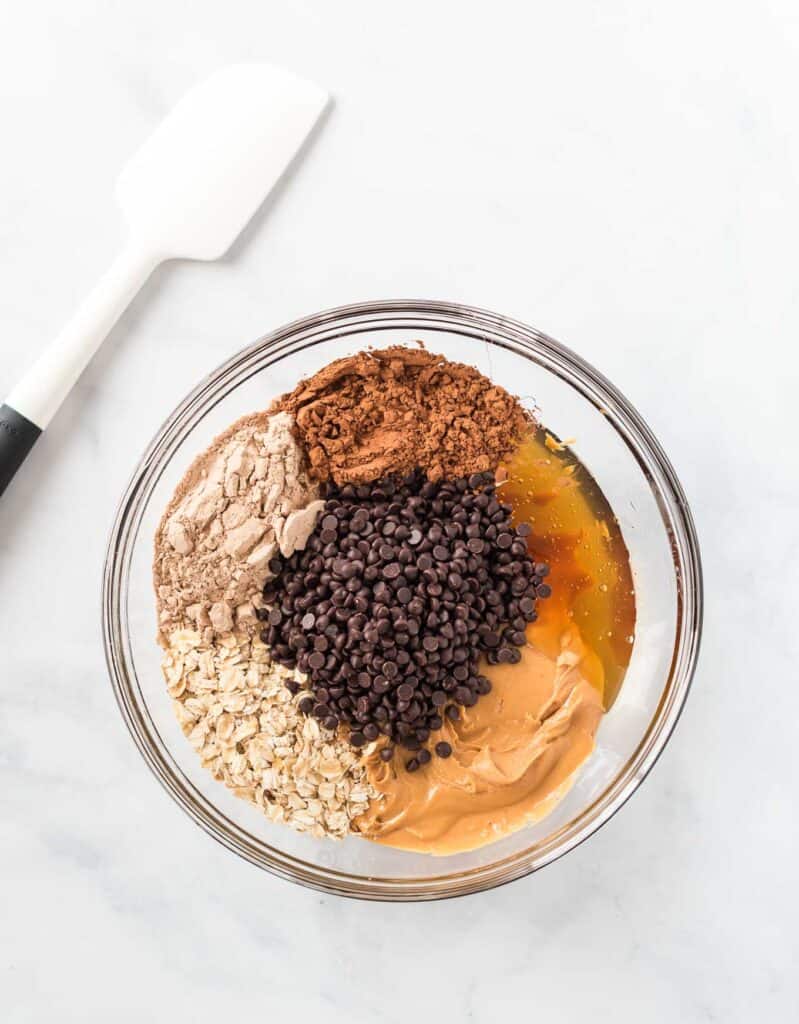 protein ball ingredients in a glass bowl