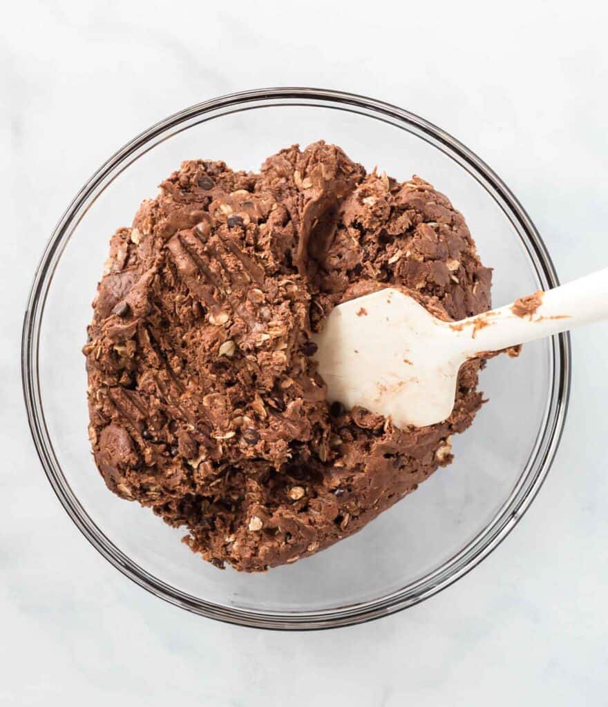 mixed together batter in a bowl with a rubber spatula