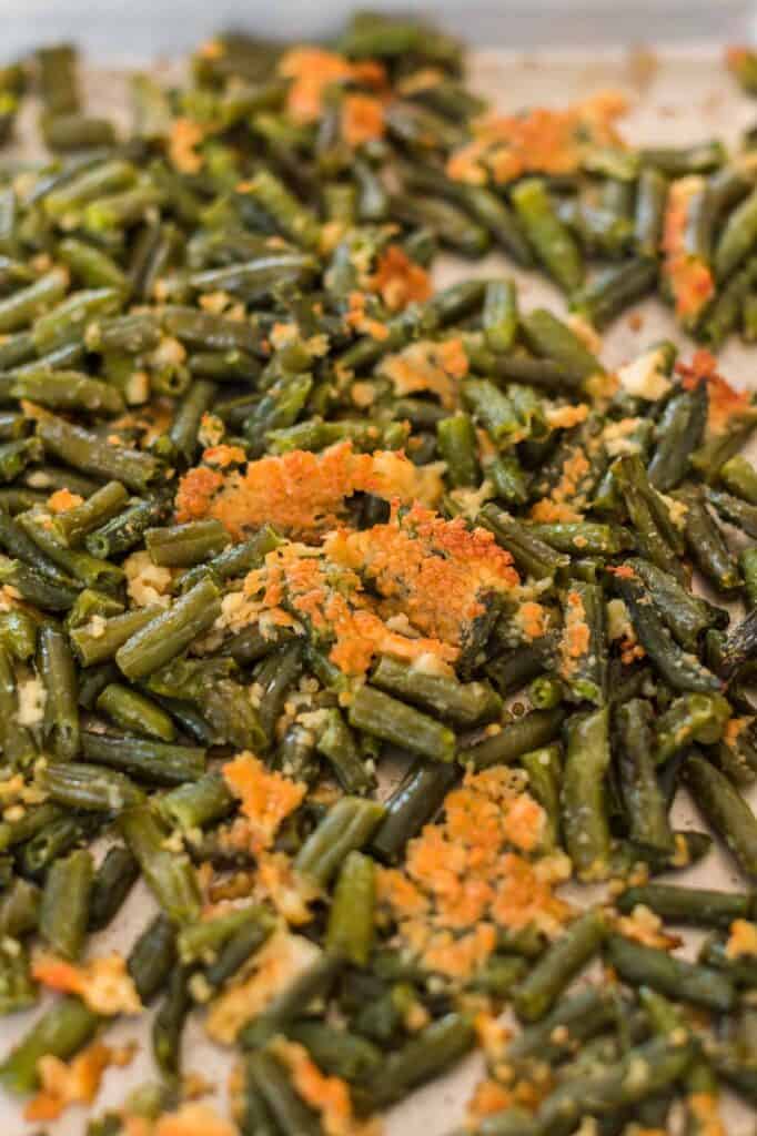 roasted frozen green beans on a baking sheet