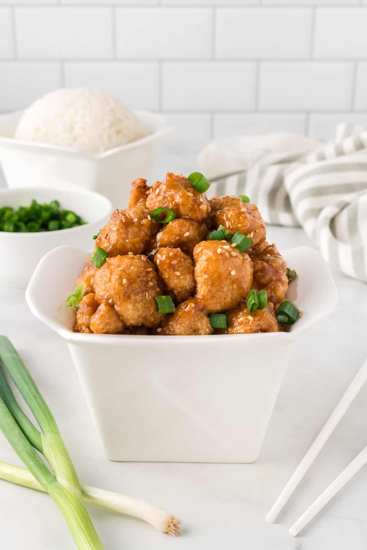 teriyaki cauliflower in a takeout container