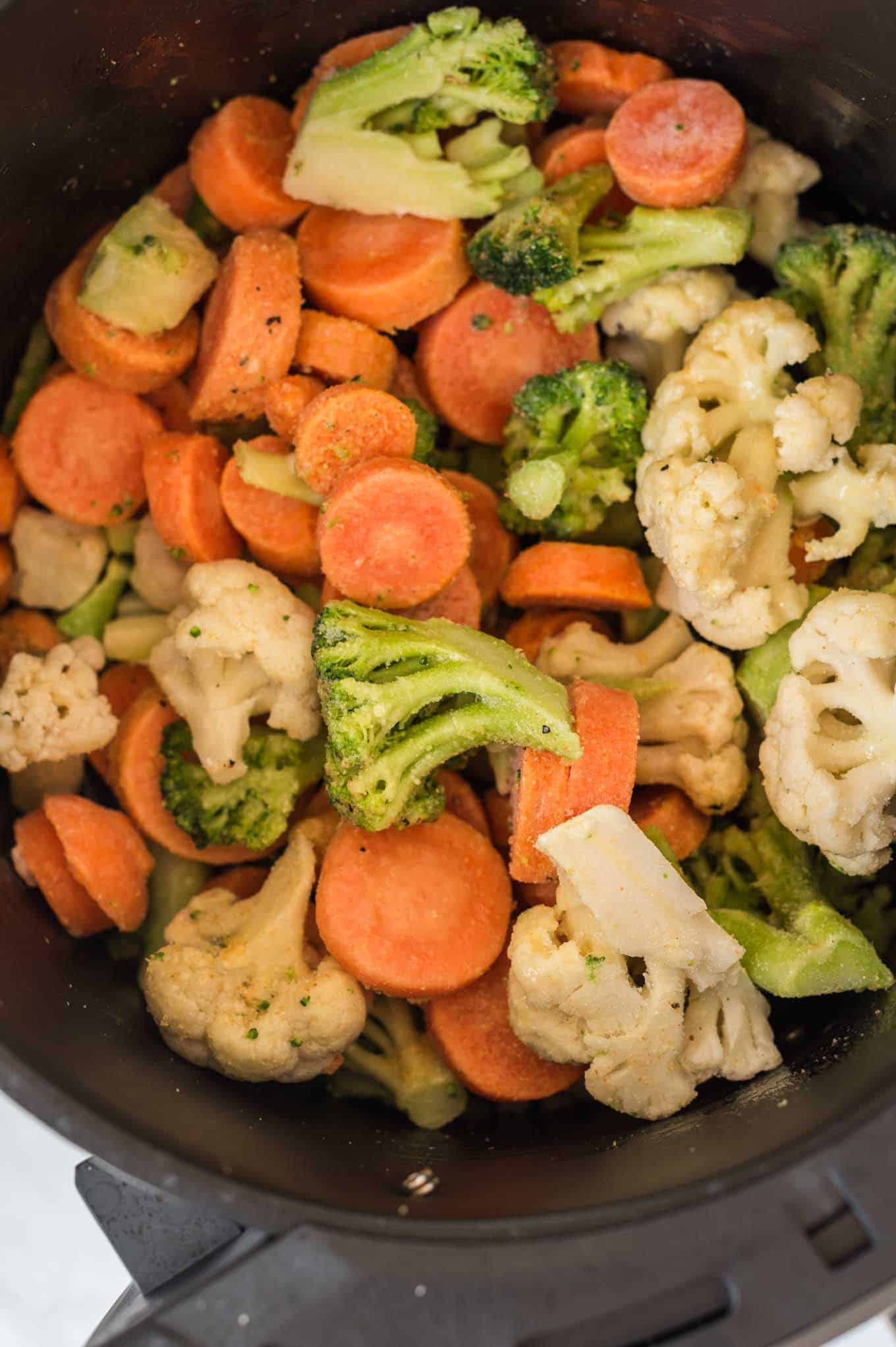 frozen mixed vegetables in an air fryer basket