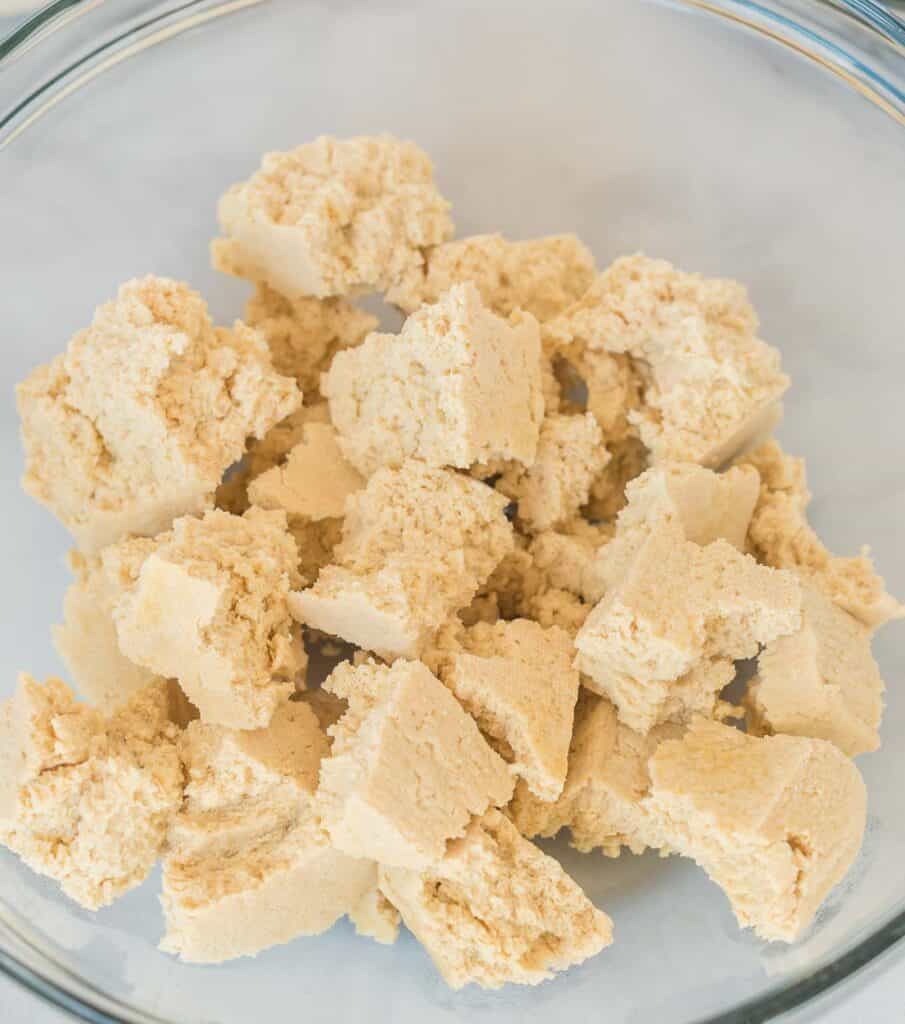 frozen tofu torn into bite sized pieces in a bowl